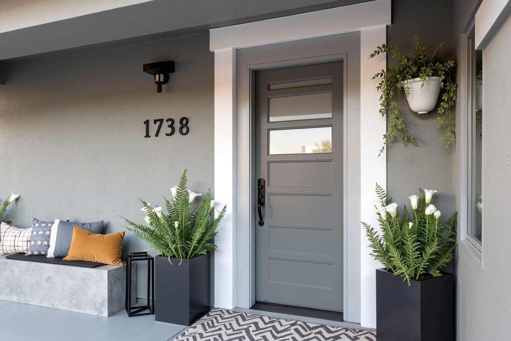 Contemporary Gray Front Door with Gray Walls and Trim, front door colors, entrance door colors, entry door hues, door paint colors, exterior door shades, entryway colors, doorway colors, entrance paint colors, entry paint shades, painting front door, refinishing front door, refreshing front entrance, updating front door, renovating entry door, repainting entrance door, coating front door, finishing front entrance, door makeover, painting front porch, refinishing porch entrance, updating front entrance, refreshing porch area, renovating entry porch, repainting porch space, coating porch surface, entrance way update, porch makeover, front door painting, entry door renovation, entrance door refinishing, door color update, doorway refreshing, entryway painting, entrance repainting, door color makeover, entry door transformation