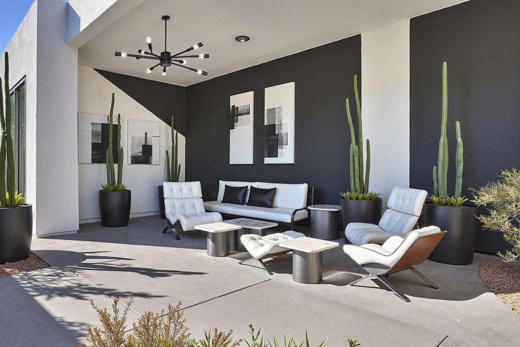 Contemporary Patio Design with Bold Black and White Geometric Walls, Phoenix, Arizona, Desert lifestyle, Desert environment, Functional Terms:, Entertainment space, Gathering spot, Outdoor retreat, Living space, Patio color ideas, Phoenix outdoor living, Desert patio design, Outdoor paint colors, Patio transformation, Secondary Keywords: , Color combinations, Desert Modern, Mediterranean Oasis, Desert Sunset, Paint Techniques:, Color blocking, Ceiling painting, Painted rug designs, Mural designs, Zoning with color, Specific Areas:, Dining zone, Living zone, Accent zone, Conversation area