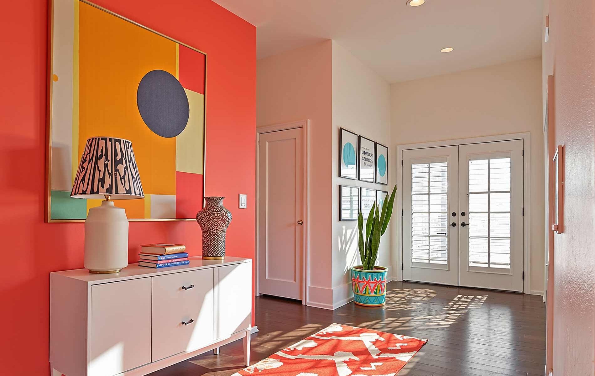 Hallway with Bold Coral Walls and White Trim and Dark Hardwood Floor, Vibrant hallway with coral walls, bold decor, dark hardwood flooring, and morning sunlight in a Scottsdale contemporary home, hallway painting ideas, hallway paint colors, hallway color schemes, hallway paint combinations, narrow hallway paint ideas, small hallway paint colors, corridor paint designs, entryway color schemes, passageway painting inspiration, foyer paint ideas, hallway color inspiration, corridor decorating concepts, entrance paint solutions, hallway makeover ideas, passage color ideas, vestibule painting concepts, color scheme, paint design, color combination, paint treatment, wall treatment, color palette, paint finish, wall colors, paint selection hallway, color choice, color pairings, color duos, paint matches, color coordination, color harmony, paint partnerships, color marriages, tone combinations, shade pairings, chromatic duets, connecting area, passage space colors, intermediate zone colors, linking space colors, connecting corridor colors, transition zone colors, thoroughfare colors, connecting pathway colors, interim space colors, passage area colors, refined, elegant, polished, upscale, distinguished painter, cultivated, tasteful, luxurious, elevated, high-end painting