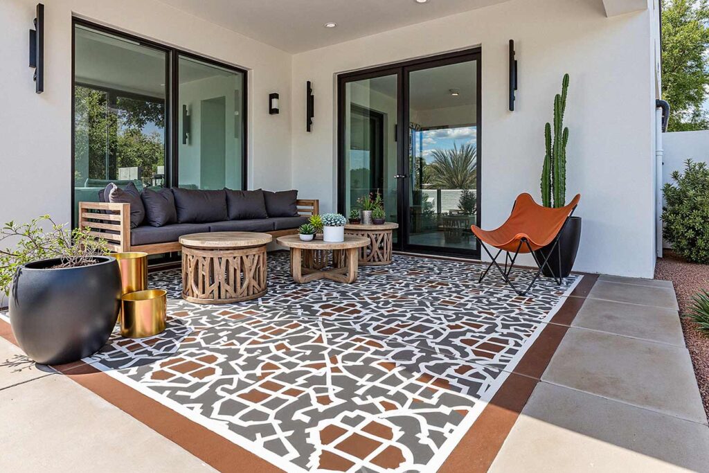 Modern Phoenix Patio with Moroccan-Inspired Painted Concrete Rug Design, Phoenix, Arizona, Desert lifestyle, Desert environment, Functional Terms:, Entertainment space, Gathering spot, Outdoor retreat, Living space, Patio color ideas, Phoenix outdoor living, Desert patio design, Outdoor paint colors, Patio transformation, Secondary Keywords: , Color combinations, Desert Modern, Mediterranean Oasis, Desert Sunset, Paint Techniques:, Color blocking, Ceiling painting, Painted rug designs, Mural designs, Zoning with color, Specific Areas:, Dining zone, Living zone, Accent zone, Conversation area