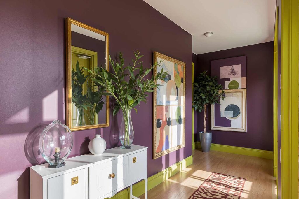 Plum Dandy Hallway Walls with Chartreuse Trim and Light Oak Floors, Bold hallway with Plum Dandy purple walls, Chartreuse trim, light oak floors, and dramatic afternoon sunlight in a Scottsdale Victorian-style home, hallway painting ideas, hallway paint colors, hallway color schemes, hallway paint combinations, narrow hallway paint ideas, small hallway paint colors, corridor paint designs, entryway color schemes, passageway painting inspiration, foyer paint ideas, hallway color inspiration, corridor decorating concepts, entrance paint solutions, hallway makeover ideas, passage color ideas, vestibule painting concepts, color scheme, paint design, color combination, paint treatment, wall treatment, color palette, paint finish, wall colors, paint selection hallway, color choice, color pairings, color duos, paint matches, color coordination, color harmony, paint partnerships, color marriages, tone combinations, shade pairings, chromatic duets, connecting area, passage space colors, intermediate zone colors, linking space colors, connecting corridor colors, transition zone colors, thoroughfare colors, connecting pathway colors, interim space colors, passage area colors, refined, elegant, polished, upscale, distinguished painter, cultivated, tasteful, luxurious, elevated, high-end painting
