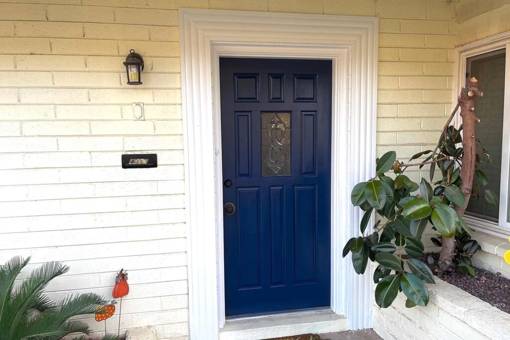 Salty-Dog-Blue-Front-Door-with-Yellow-Walls-and-White-Trim, front door colors, entrance door colors, entry door hues, door paint colors, exterior door shades, entryway colors, doorway colors, entrance paint colors, entry paint shades, painting front door, refinishing front door, refreshing front entrance, updating front door, renovating entry door, repainting entrance door, coating front door, finishing front entrance, door makeover, painting front porch, refinishing porch entrance, updating front entrance, refreshing porch area, renovating entry porch, repainting porch space, coating porch surface, entrance way update, porch makeover, front door painting, entry door renovation, entrance door refinishing, door color update, doorway refreshing, entryway painting, entrance repainting, door color makeover, entry door transformation