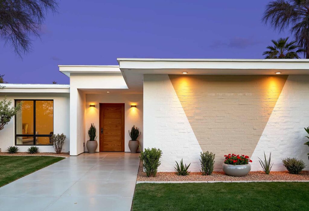 White Mid-Century Modern with White Trim and Beige Design, exterior home painting, residential facade enhancement/transformation, house exterior treatment/enhancement, dwelling surface decoration/coloration, property outer wall treatments/designs, architectural surface painting/treatment, building perimeter decoration/enhancement, home outside surface applications/design, facade improvement, residential exterior transformation, house surface painting, geometric shapes, triangular elements, diagonal lines, garage door transformations, desert modern, mid-century modern, color coordination, architectural interest, strategic lighting, visual energy, curb appeal, neighborhood standout, color blocking, architectural features