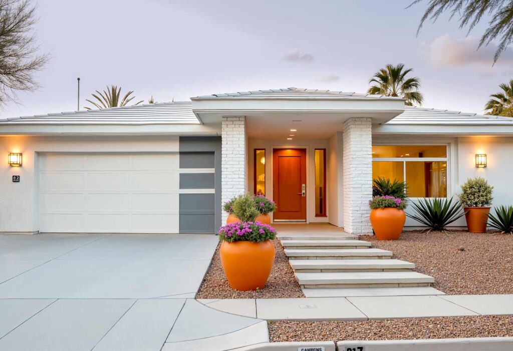 White Mid-Century Modern with White Trim and Gray Design, exterior home painting, residential facade enhancement/transformation, house exterior treatment/enhancement, dwelling surface decoration/coloration, property outer wall treatments/designs, architectural surface painting/treatment, building perimeter decoration/enhancement, home outside surface applications/design, facade improvement, residential exterior transformation, house surface painting, geometric shapes, triangular elements, diagonal lines, garage door transformations, desert modern, mid-century modern, color coordination, architectural interest, strategic lighting, visual energy, curb appeal, neighborhood standout, color blocking, architectural features