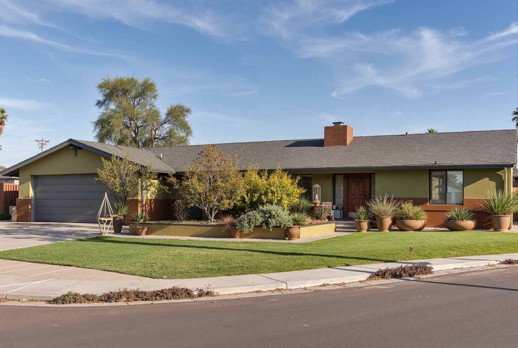 Ranch Home with Olive Green Walls Cedar Accent Charcoal Trim, ranch house color scheme, ranch house colors, Exterior color ideas, House painting inspiration, Two-tone color scheme, Ranch architecture, ranch style, ranch home, ranch silhouette, Color combination, color palette, color pairing, color expression, Exterior Facade, outdoor, outside surface, exterior walls, Modern, Contemporary, current, updated, fresh, Transformation, Makeover, reimagining, updating, refreshing,