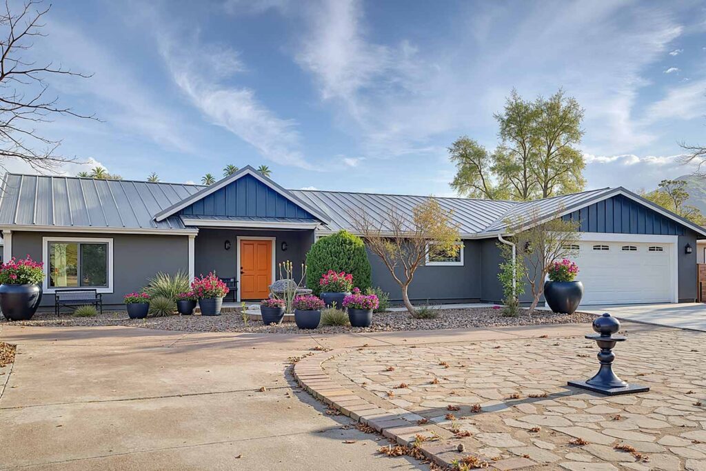 Ranch-Style Home with Gray Walls Slate Blue Accents White Trim Ochre Door, ranch house color scheme, ranch house colors, Exterior color ideas, House painting inspiration, Two-tone color scheme, Ranch architecture, ranch style, ranch home, ranch silhouette, Color combination, color palette, color pairing, color expression, Exterior Facade, outdoor, outside surface, exterior walls, Modern, Contemporary, current, updated, fresh, Transformation, Makeover, reimagining, updating, refreshing,