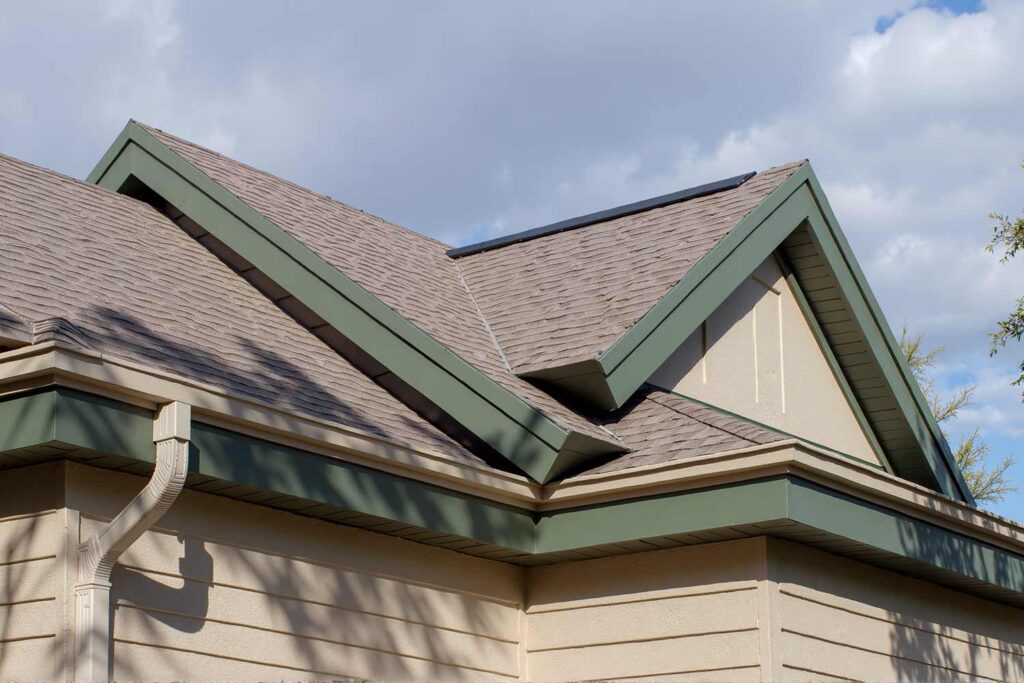 Arcadia House With Taupe Walls and Dark Sage Green Fascia and Soffit, soffit and fascia color schemes, trending eave paint colors, contemporary eave color choices, modern eaves color schemes, house painting exterior