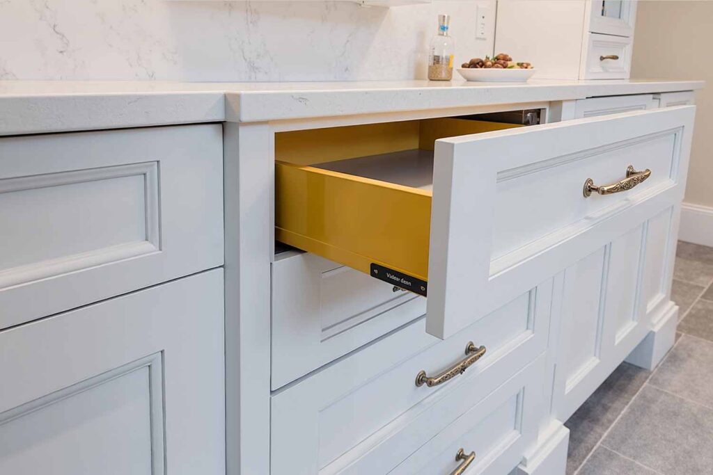 Beautiful White Cabinets-The Inside Of The Drawers are Painted Golden Yellow, painting kitchen cabinets, cabinet painting, cabinet paint transformation, refreshing cabinets, updating kitchen cabinets, cabinet color application, painting contractor, professional painter, cabinet painting expert, painting professional, cabinet refresh concepts, cabinet update inspiration, cabinet renovation ideas, cabinet redesign strategies, creative kitchen cabinets