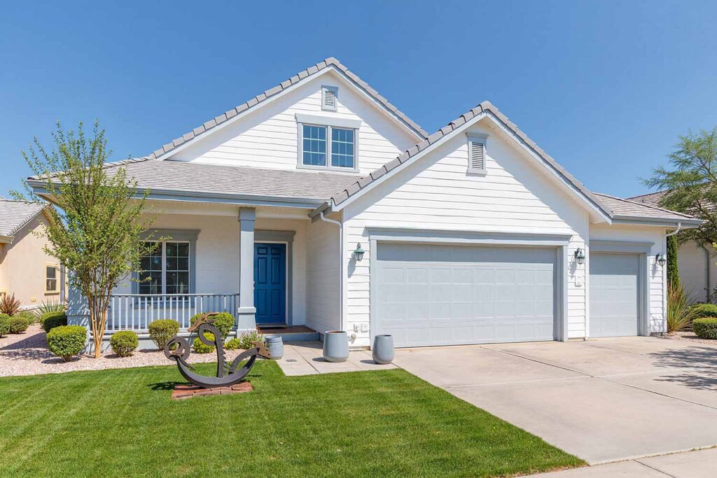 Contemporary Coastal Ranch with Soft White Exterior Marine Blue Door and Pale Gray Trim, house exterior color ideas, ranch house colors, exterior color ideas, house painting colors, Curb appeal, Color combinations, Accent wall, Trim colors, Door colors, Visual impact, Color palettes, home exterior paint schemes, Outside house color palettes, Facade color inspiration, painter phoenix, painters in phoenix, painting contractor, paint contractor