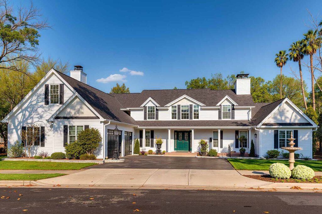 Elegant Colonial Revival with Classic White Walls Black Trim and Green Front Door, house exterior color ideas, ranch house colors, exterior color ideas, house painting colors, Curb appeal, Color combinations, Accent wall, Trim colors, Door colors, Visual impact, Color palettes, home exterior paint schemes, Outside house color palettes, Facade color inspiration, painter phoenix, painters in phoenix, painting contractor, paint contractor