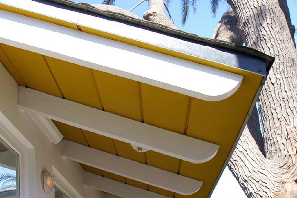 Phoenix Arcadia House with White Walls and Rafters with Yellow Eaves, soffit and fascia color schemes, trending eave paint colors, contemporary eave color choices, modern eaves color schemes, house painting exterior