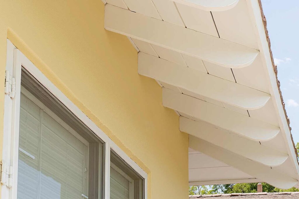 Phoenix House with Exposed White Rafters and Yellow Walls, soffit and fascia color schemes, trending eave paint colors, contemporary eave color choices, modern eaves color schemes, house painting exterior