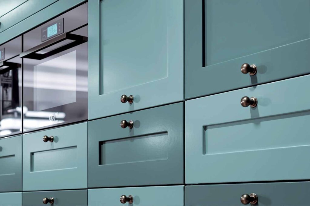 Teal Shaker-style Cabinets With Checkerboard Configured Colors, Cabinet accent painting, Specialty cabinet finishes, Bold cabinet graphics, Cabinet mural designs, Artistic cabinet treatments, Contemporary cabinet art, Cabinet stencil painting, Color-blocked cabinets, Linear cabinet designs, Cabinet makeover ideas, Kitchen cabinet striping, Cabinet feature painting, Unique cabinet finishes, Statement cabinet art, Transformative cabinet painting, Painted kitchen accents, Cabinet surface design, Decorative kitchen makeovers, Modern kitchen pattern painting