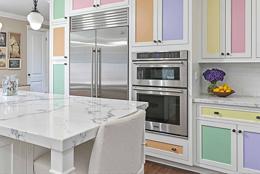 White Kitchen Cabinets With Different Pastel Colored Panels, painting kitchen cabinets, cabinet painting, cabinet paint transformation, refreshing cabinets, updating kitchen cabinets, cabinet color application, painting contractor, professional painter, cabinet painting expert, painting professional, cabinet refresh concepts, cabinet update inspiration, cabinet renovation ideas, cabinet redesign strategies, creative kitchen cabinets