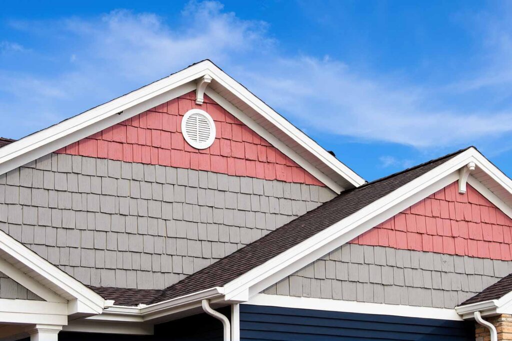 Arcadia Home With Navy Blue Walls and Gray Walls and Rose Pink Gables, decorating gable features, triangular section finishing, roof end decoration, gable area coating, gable color enhancement, painting dormer, dormer painting, decorative truss, gable wall, gable colors, house painters Phoenix