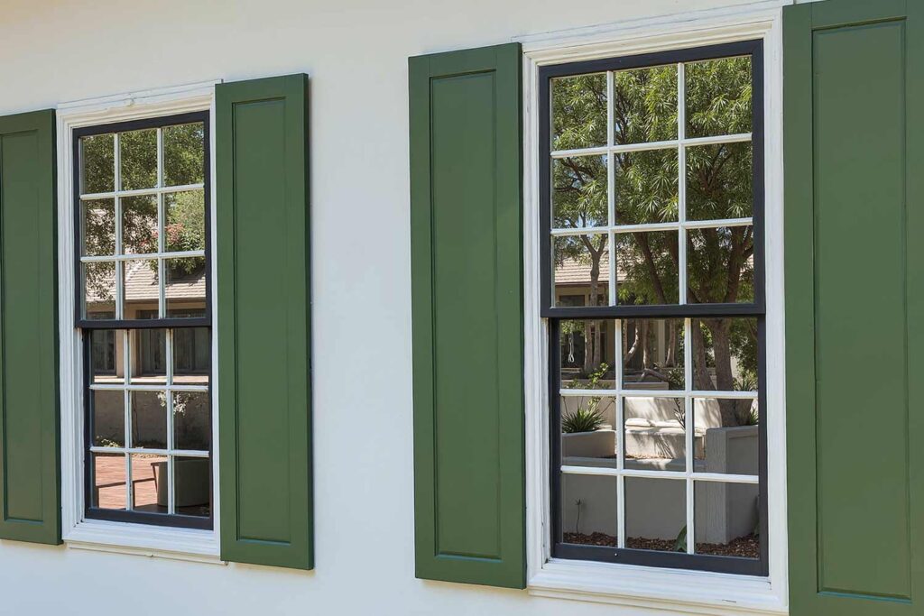 Mid-Century Modern Phoenix White House with Avocado Green Shutters and Black Trim, shutter tints, shutter palettes, exterior shutters, custom shutter colors, shutter finish options, decorative shutters, shutter material colors, shutter style and color