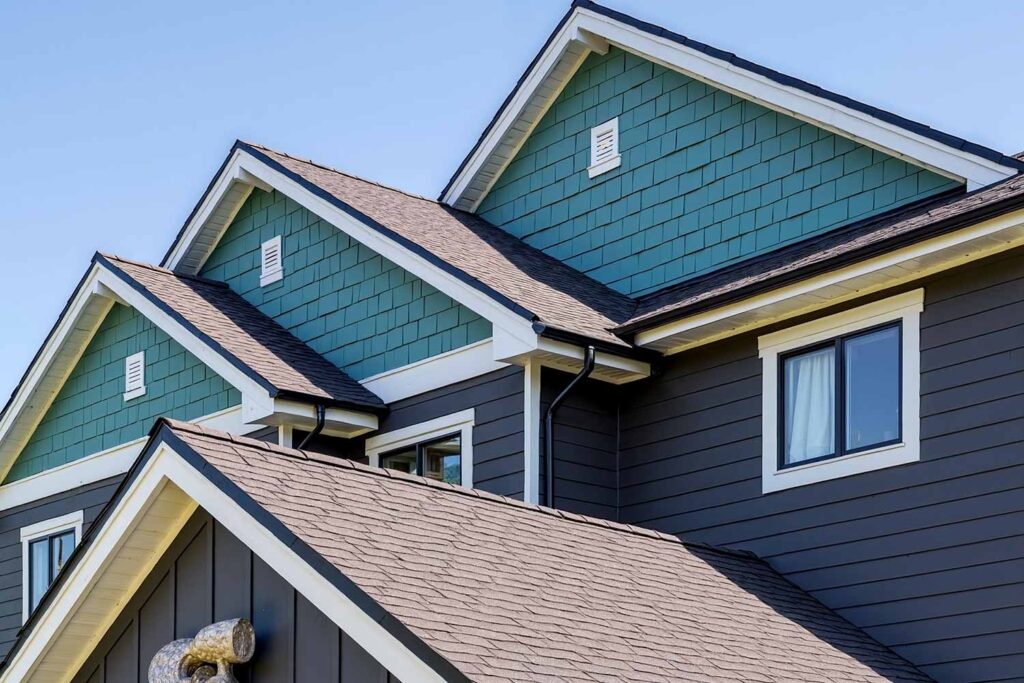 Scottsdale Farmhouse with Teal Gable Charcoal Walls And White Trim, coloring triangular wall ends, finishing triangular facade sections, coating gable faces, gable end coloration, peak end finishing, applying paint to architectural peaks, finishing triangular roof sections, house painting exterior