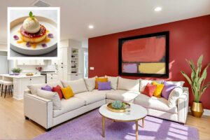living room with creamy vanilla walls with red accent wall and white trim and lavender rug FEATURE, house color inspiration, interior house paint colors inspired by food unique house color inspiration from everyday items, unique house color inspiration from instagram food, unique house color inspiration from instagram desserts, interior color schemes based on desserts