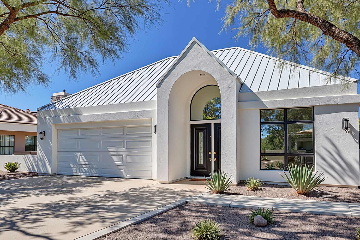 energy efficient house with white walls and white roof, contemporary home white walls black trim dark door white metal roof desert landscaping Scottsdale morning sunlight driveway with tire marks, white house with black accent in Phoenix, Arizona, best exterior home painting contractors, Transform Your Home's Curb Appeal with one of the Best Exterior Painting Contractors in Phoenix, best exterior painting contractors, exterior painting contractor near me, exterior painting contractors near me, exterior paint contractor near me, exterior paint contractors near me, exterior painting company near me, exterior house painting contractors, exterior home painting contractors, exterior painting contractor, exterior painting contractors, exterior paint contractors, Phoenix, Scottsdale, Arcadia