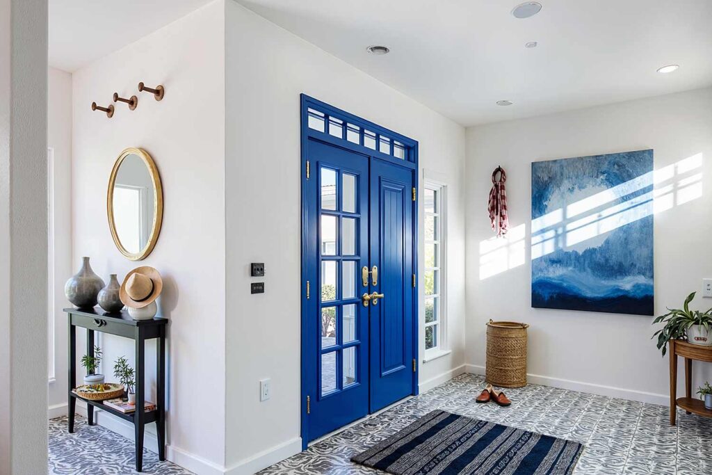 entryway with cobalt blue door and trim white walls patterned tile floor, bold entryway with cobalt blue door and trim white walls and patterned tile floor in a scottsdale home featuring modern décor and dramatic moody lighting, room color plan, interior color palette, color coordination for interiors, house paint colors (interior), indoor paint colors, home interior colors, interior paint color ideas, coordinating interior colors, matching interior colors, interior color combinations, color pairings for home
