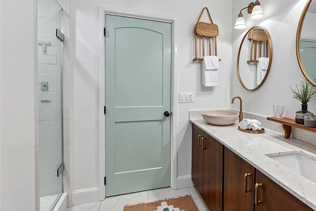 spa bathroom with muted aqua door white walls white trim marble flooring, spa bathroom with a muted aqua door white walls and marble flooring in a scottsdale home featuring calming décor and dramatic moody lighting, painting interior doors, door painting ideas, interior door painting, interior color scheme, interior house colors, interior color pairings, painting inside doors, painting indoor doors, painting doors inside the house, interior door makeover, updating interior doors with paint