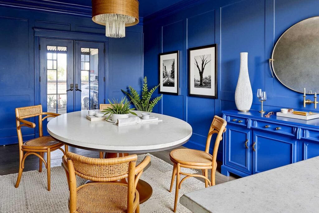 Color Drenched Interior Paint Cobalt Blue Dining Room with Polished Concrete Floors-4, tone-on-tone interior, monochromatic paint scheme, bold immersive interior, single-color room painting, deep color room design, enveloping paint treatment, all-encompassing interior color, room-wide color commitment