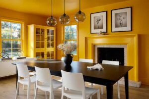 Deep Saffron Color Drenched Interior Paint Dining Room with Light White Oak Floors-4, tonal paint technique, cohesive color interior, all-surface color painting, wraparound color design, floor-to-ceiling color scheme, saturated room painting, seamless color interior, whole-room color palette