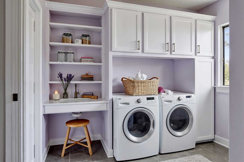 Laundry Room with Soft Lavender Walls White Trim and White Cabinets-1, laundry room paint colors, laundry room color schemes, laundry room color palettes, paint colors for laundry rooms, best colors for laundry rooms, washroom paint colors, laundry space hues, laundry room paint shades