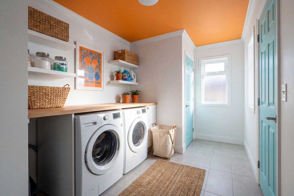 Laundry Room with Vibrant Tangerine Ceiling Pure White Walls and Aqua Blue Door-2, painted ceilings, Colored ceilings, Painted overhead spaces, Custom ceiling colors, Painted ceiling designs, Accent ceilings