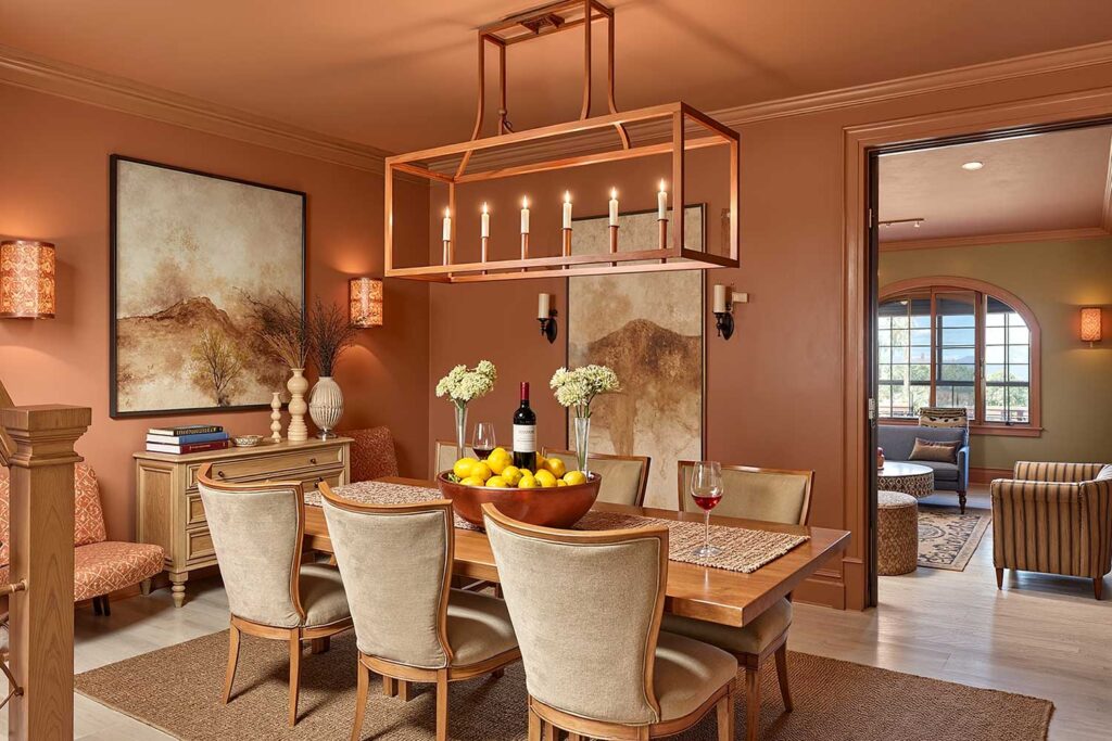 Sun-Baked Terracotta Color Drenched Dining Room with Bleached Wood Floors-1, color drenching interior paint, immersive interior color, all-over interior paint, enveloping color scheme, single-hue room design, full-room color saturation, unified color interior, total surface paint treatment