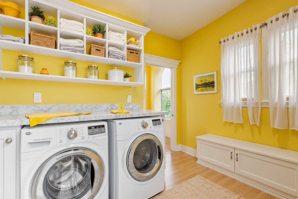 Vibrant Laundry Room with Yellow Walls White Trim and Cabinets-3, laundry room paint ideas, laundry room painting inspiration, laundry room paint color inspiration, laundry room color inspiration, ideas for painting a laundry room, laundry room design ideas, washroom paint inspiration, laundry room makeover colors