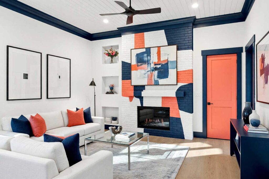 Living Room with White Fireplace and Navy and Coral Geometric Shapes-4, indoor brick fireplace makeover, living room fireplace transformation, painted fireplace renovation, modernizing outdated brick fireplaces, updating 1970s brick fireplace, updating ugly brick fireplace, contemporary fireplace makeover, reviving old brick fireplaces, painted stone fireplace ideas, updating a stone fireplace, painted river rock fireplace, stone fireplace color transformations, painted faux stone fireplace, whitewashed brick fireplace ideas, limewash fireplace inspiration
