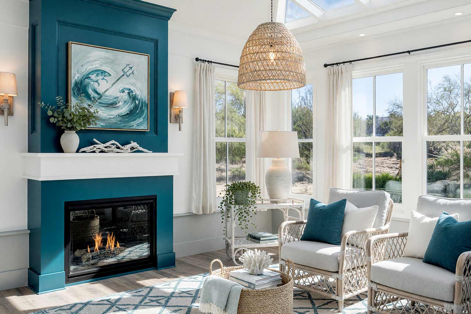 Coastal Sunroom with White Walls and Teal Accent Wall and Gray Lower-1, coastal escape sunroom soft white walls deep teal accent wall pale gray trim whitewashed driftwood floors scottsdale neighborhood. A bright sunroom in a Scottsdale neighborhood featuring soft white walls and ceiling with a deep teal accent wall. The space includes a pale gray linen sofa, a whitewashed rattan armchair, and a woven seagrass pendant light. Bright afternoon sunlight creates dramatic shadows and highlights, evoking a cool and serene coastal retreat perfect for desert living. sunroom paint palette, arizona room paint palette, sunroom wall colors, sunroom paint inspiration, desert sunroom color ideas, arizona room decor colors, sun porch paint colors