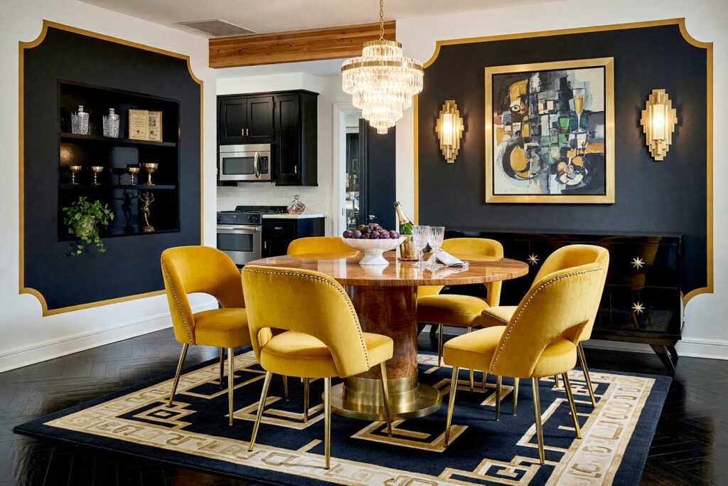 Art Deco Dining Room with Charcoal Black Walls and Golden Ochre Portal-5, art deco dining room charcoal black walls golden ochre painted wall graphics soft white ceiling ebony hardwood flooring. An opulent 1920s supper-club dining room in a Scottsdale neighborhood featuring charcoal black walls, a soft white ceiling, and a rounded portal frame in rich golden ochre. Styled with a burl wood table, fluted glass chandelier, velvet chairs, and a cubist jazz painting over ebony hardwood. Striking directional lighting creates deep, dramatic shadows, establishing a luxurious space for evening entertaining. painted wall graphics, wall murals, painted murals