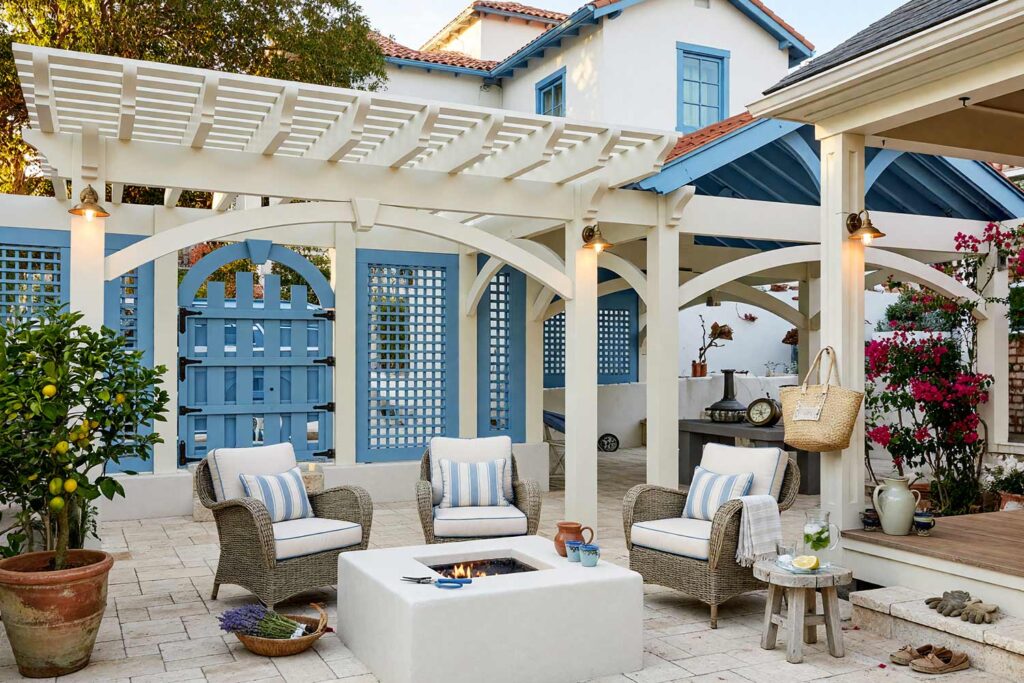 Pergola with Ivory Framing and Sky Blue Privacy Trellis-6, coastal pergola ivory wood posts sky blue trellis garden gate pergola paint colors. Located at an upscale Scottsdale property, this Greek Isles-inspired retreat pairs semi-gloss ivory beams with a brilliant sky blue trellis screen and garden gate. Whitewashed limestone flooring, a rope hammock, and a potted lemon tree bask beneath dynamic golden-hour light and sharp architectural shadows. pergola paint colors, painted pergola ideas, painting an outdoor pergola, painting backyard ramada, pergola color ideas, pergola color schemes, what color to paint a pergola