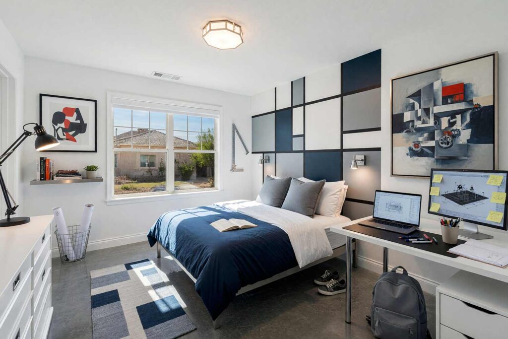 Teenager’s Bedroom with Crisp White Walls and Dove Gray with Deep Navy Wall Design-4, kid’s bedroom paint colors bauhaus blueprint crisp white dove gray deep navy polished concrete floor. An aspirational Bauhaus-inspired child’s bedroom in a Scottsdale neighborhood featuring crisp white walls, a geometric grid panel in dove gray and deep navy, and lustrous crisp white semi-gloss woodwork. The functional studio retreat pairs an unmade tubular steel bed with a streamlined study desk hosting an active dual-screen computer setup, steel shelving, and hidden storage. Polished concrete floors and dramatic directional sunlight create a sophisticated, high-contrast space tailored for young designers. kids bedroom paint ideas, child's bedroom color palette, kids room paint colors, toddler bedroom paint colors, kids bedroom colors